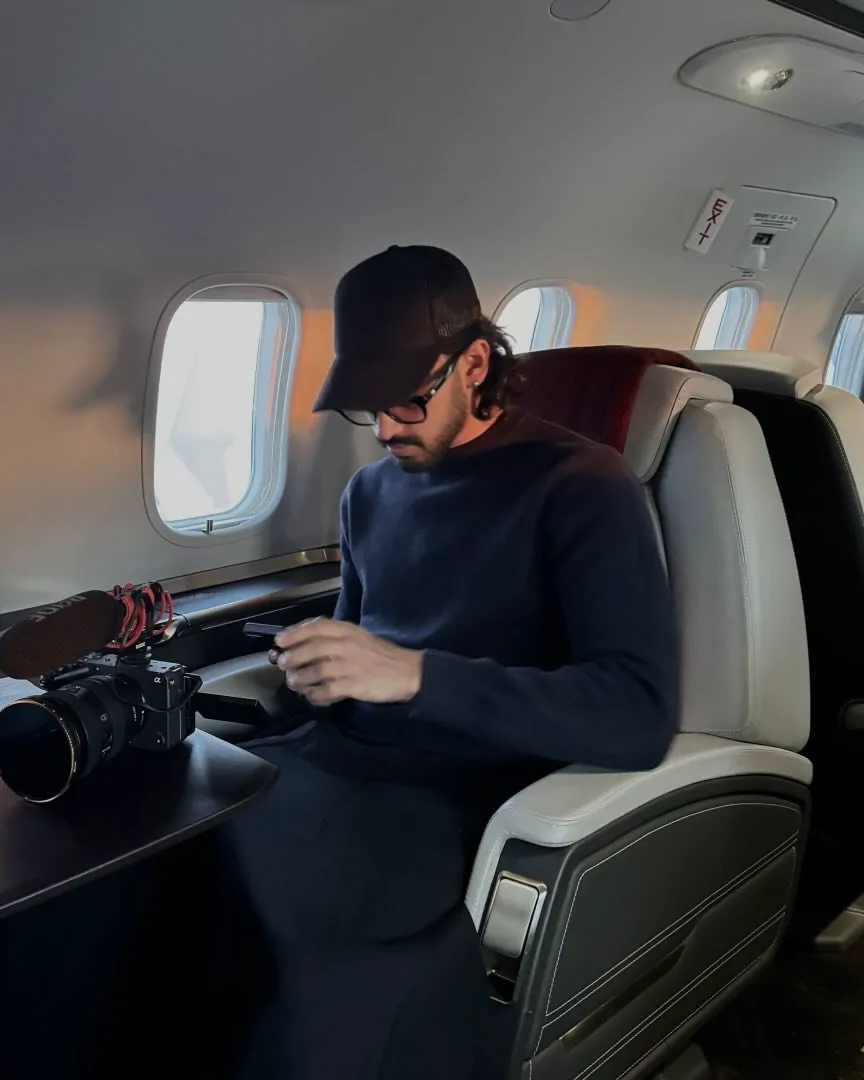 Nish with his camera on a private jet